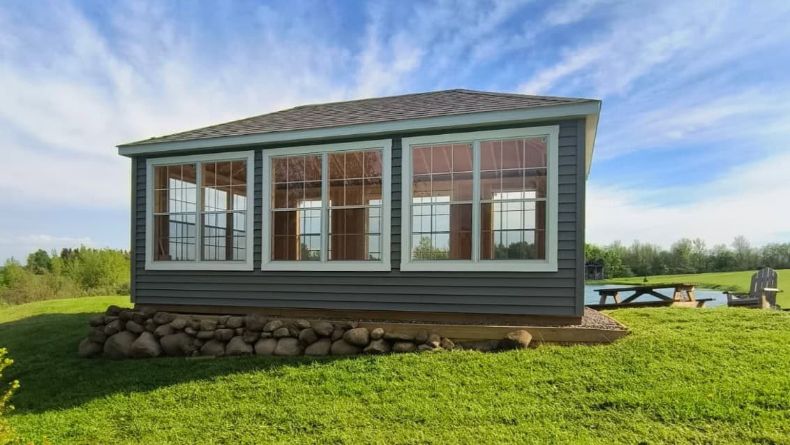 Sturdi-Built 12 X 16 Sunroom On Stone Pad Overlooking A Customer'S Pond