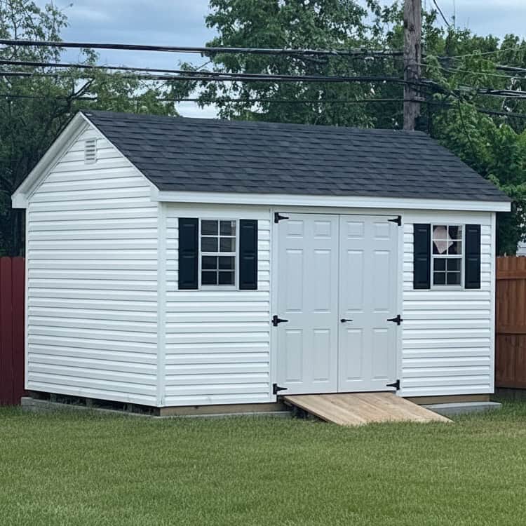 Customer Delivery 10X14 Fr Cape May 2026 11 - Sturdi-Built Sheds 10X14 Vinyl Backyard Shed In A Backyard With A Ramp